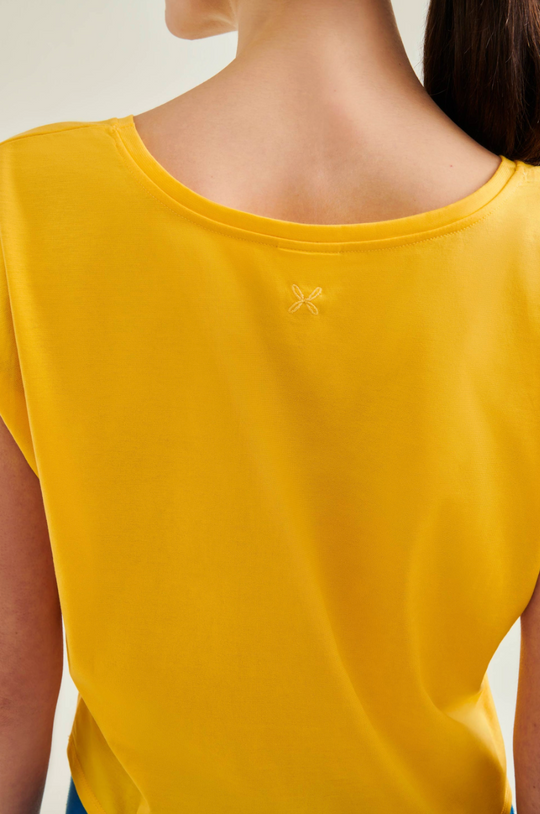 Yellow t-shirt with a brand logo on a plain background