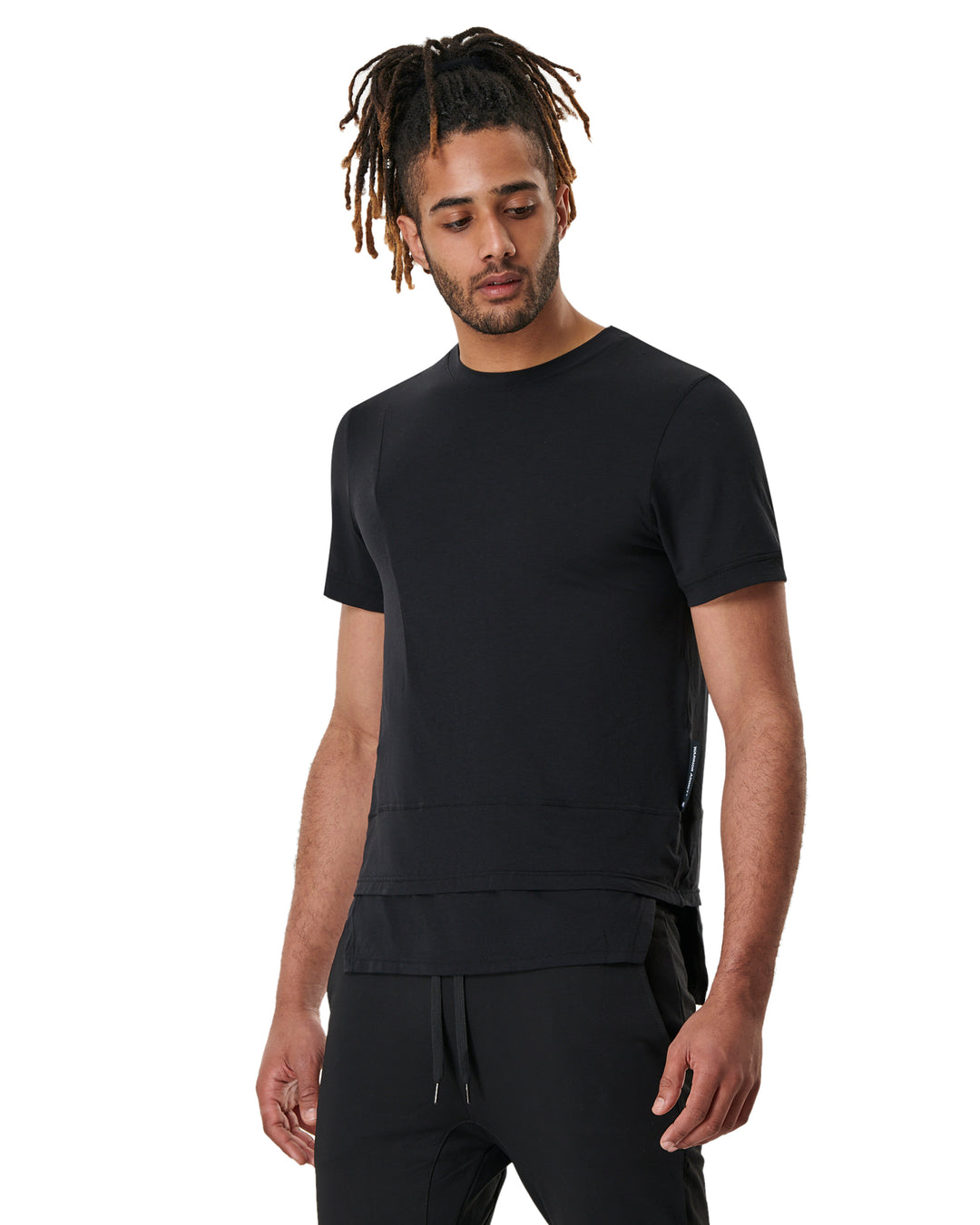 Man in black t-shirt and sweatpants.