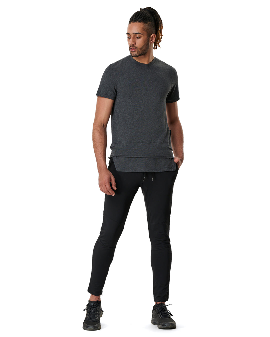 Man in gray tee and black athletic pants.
