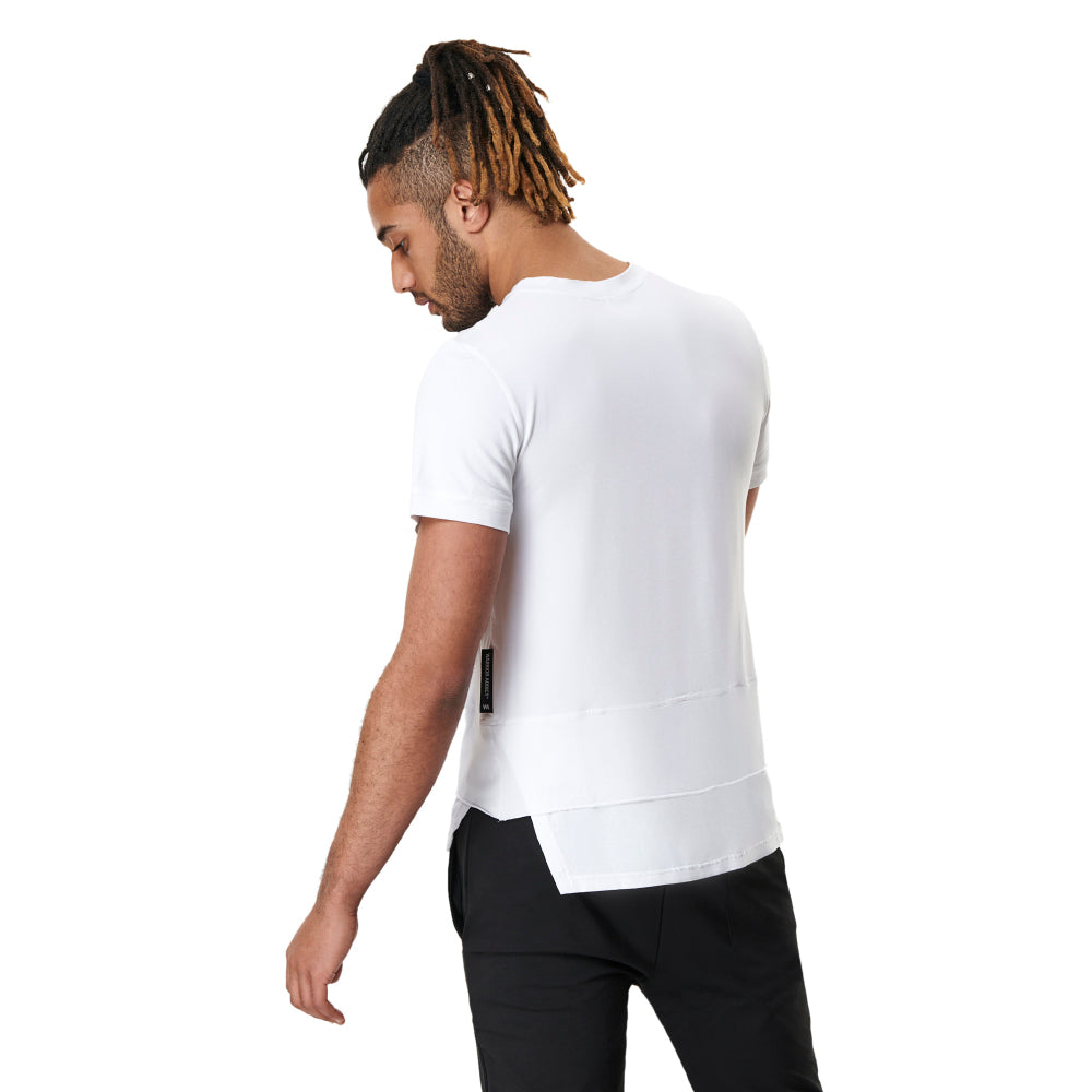 Man in white T-shirt and black pants from behind.