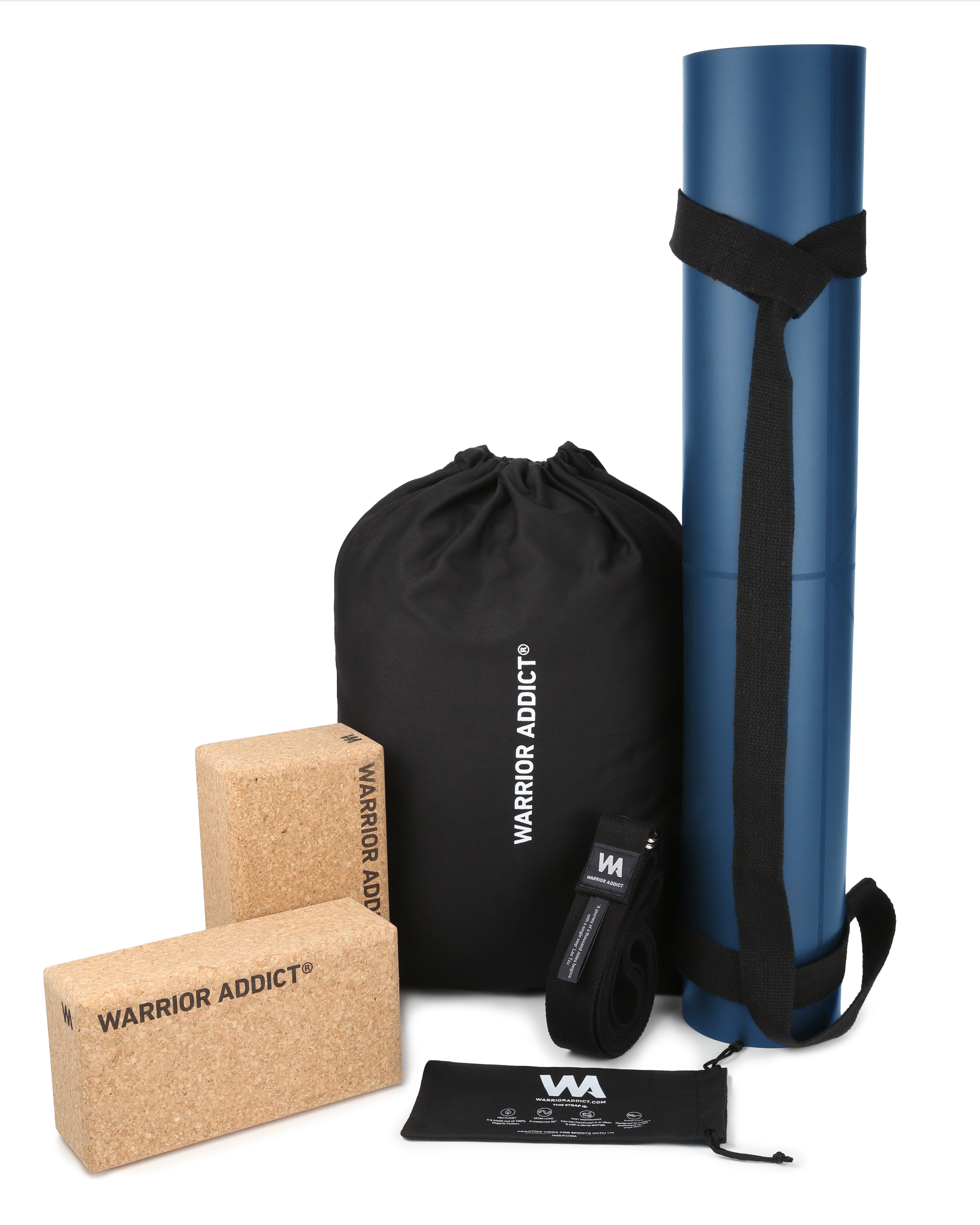 A blue yoga mat, black bag, cork blocks, and yoga strap from Warrior Addict are arranged on a white background.