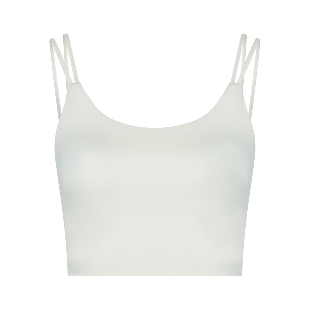 White crop top with spaghetti straps.
