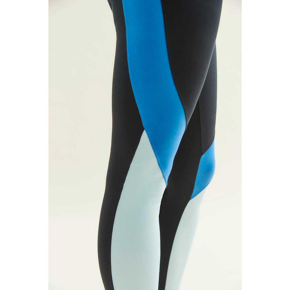 Close-up of leggings in black, bright blue, and light blue.