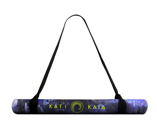 Rolled purple yoga mat with a black carrying strap.