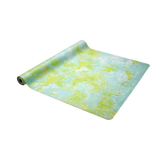 Unrolled green and blue yoga mat.
