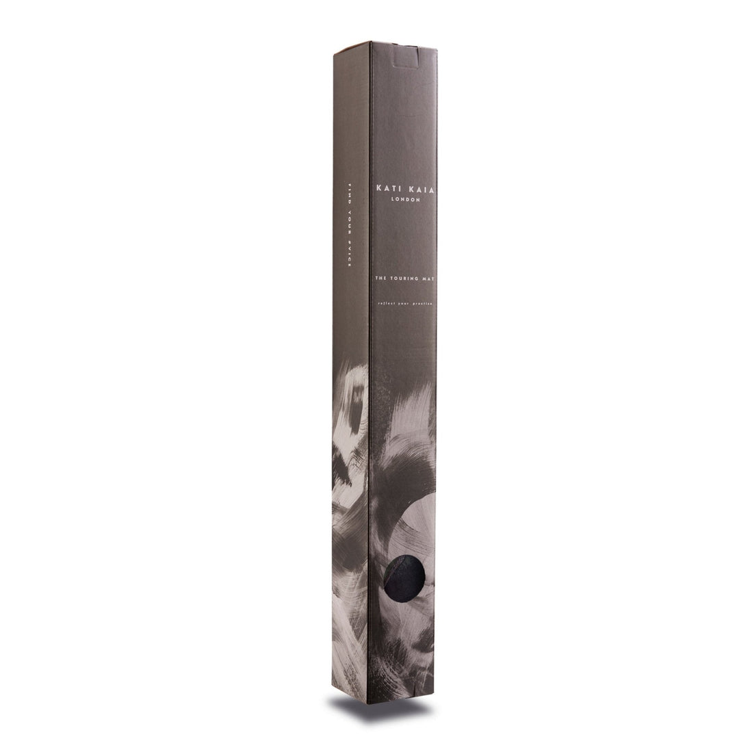 Tall, narrow box for Kati Kaia London "The Touring Mat" with gray, black, and white design.