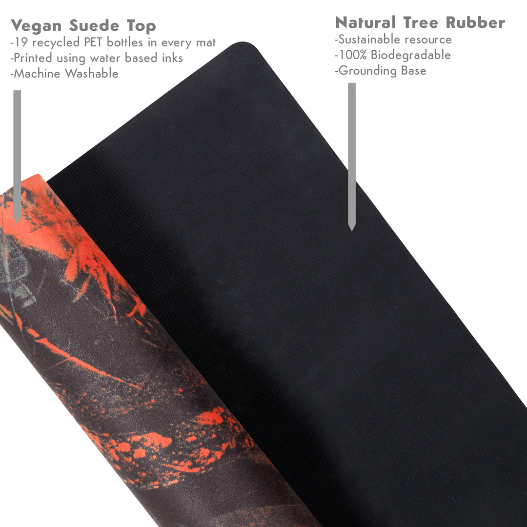 Rolled up yoga mat with a vegan suede top layer and a natural tree rubber base.