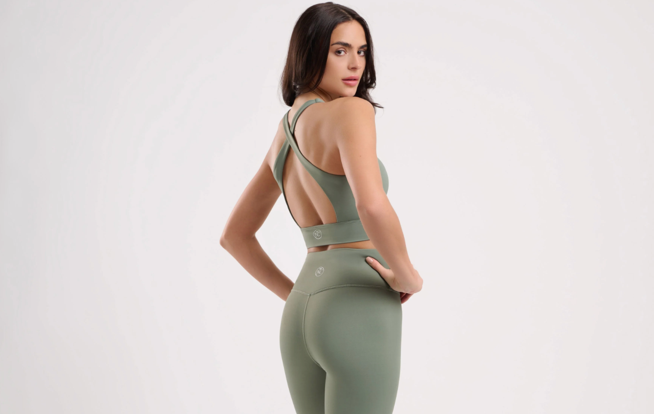 woman wearing olive green activwear top and leggings