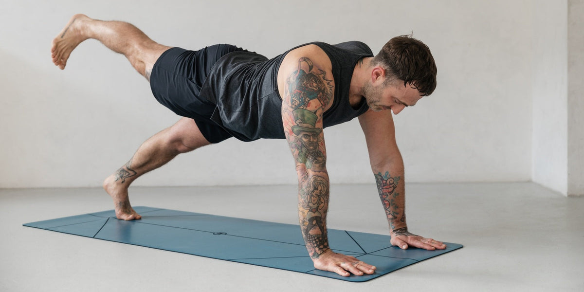 man on a blue warrior yoga mat