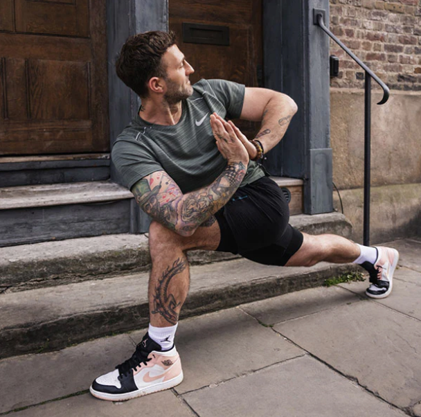 man parcticing yoga outside