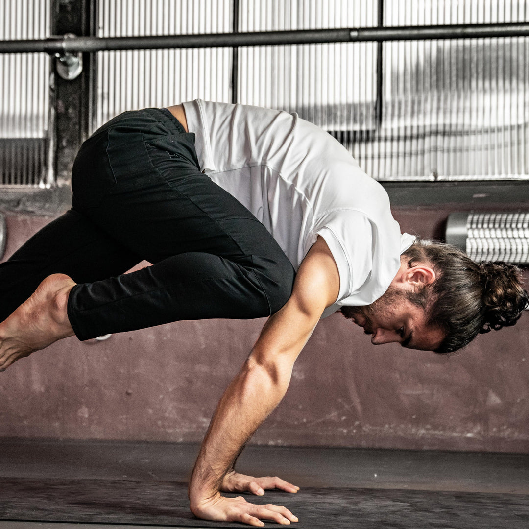 man doing a yoga pose 