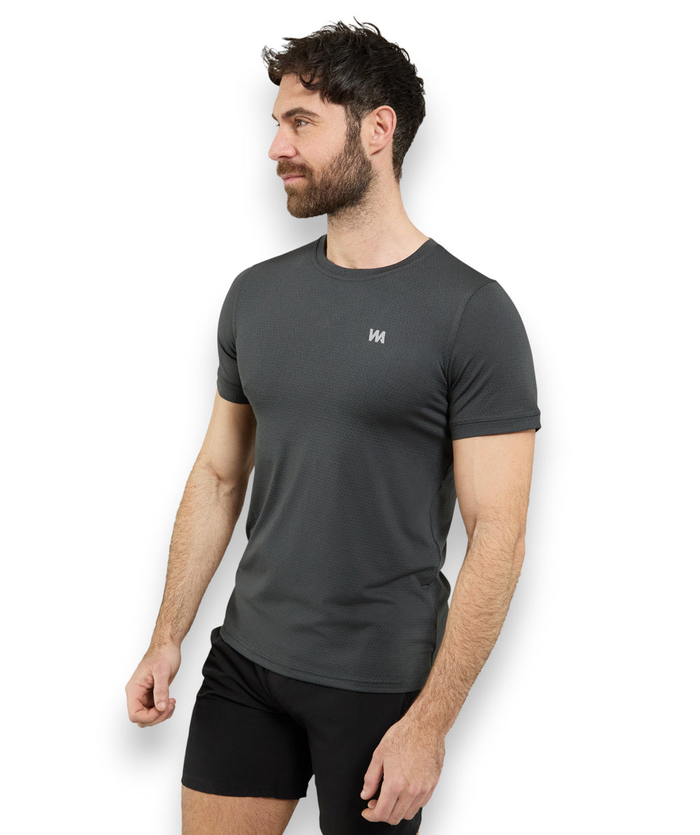 Man wearing a  black warrior addict  gym t-shirt with a logo on a white background
