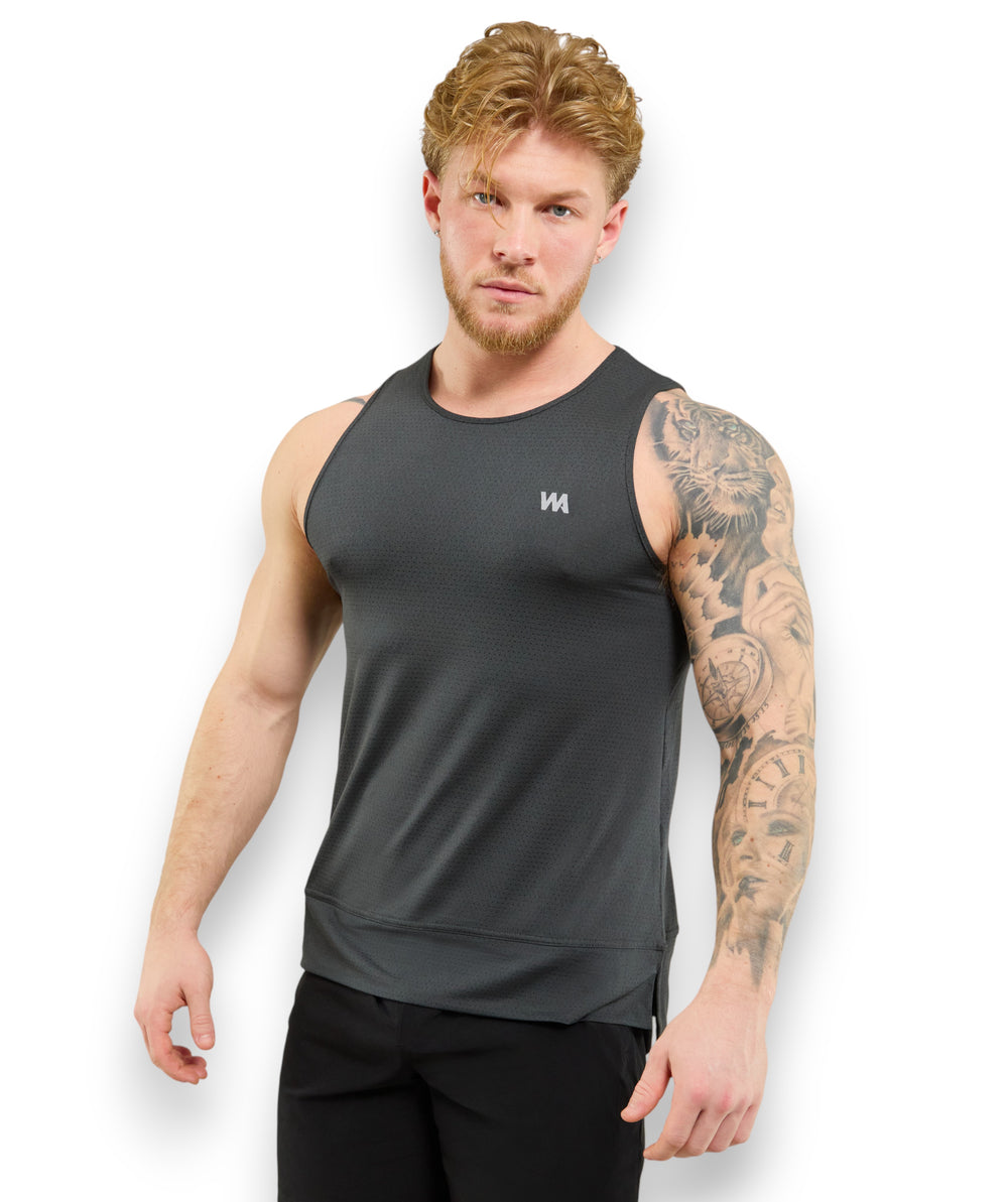 man wearing Warrior addict men's  tank top  in black  with inversion tech no ride up mechanism