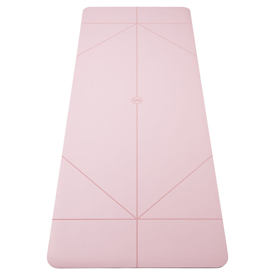 A light pink yoga mat with geometric line patterns and a small circular logo in the center, shown flat against a solid white background.