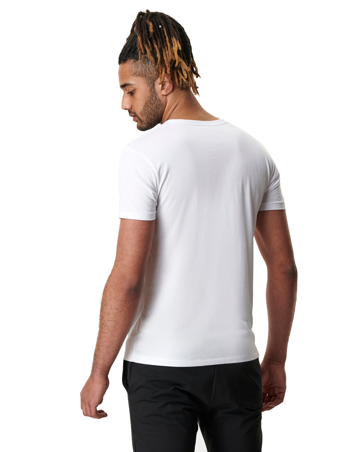 back view of man in white men&#39;s yoga t-shirt by warrior addict 