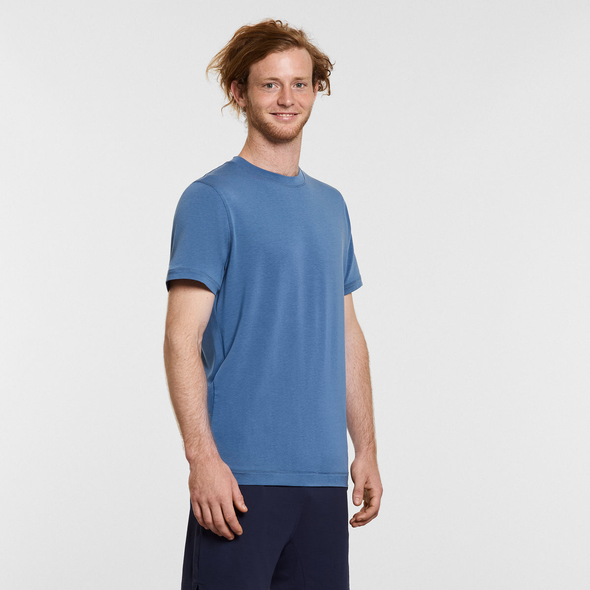 man wearing blue mens yoga t-shirt by warrior addict 