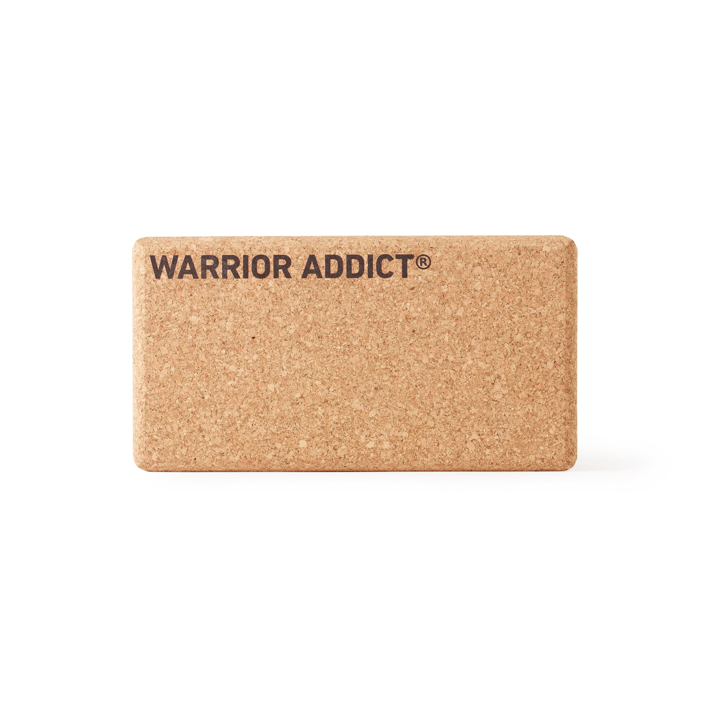 Cork yoga block with the words "WARRIOR ADDICT®" printed on the top.
