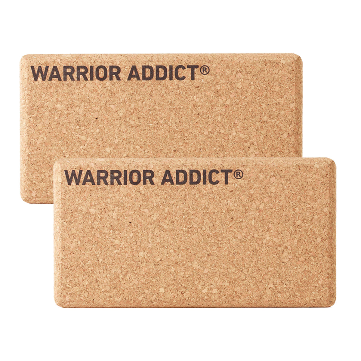 front view of two cork yoga blocks with warrior addict logo on