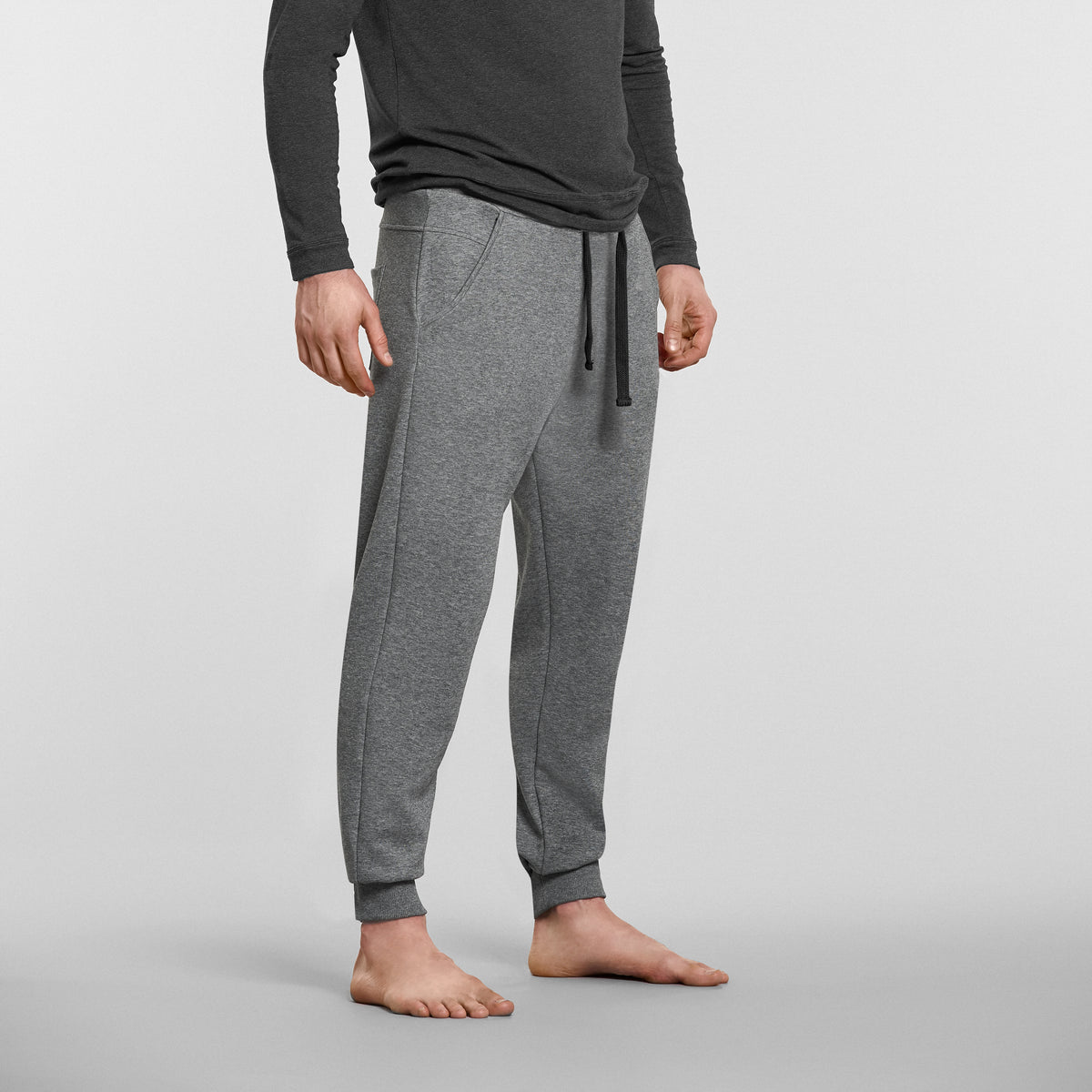 man wearing grey mens yoga pants by warrior addict 