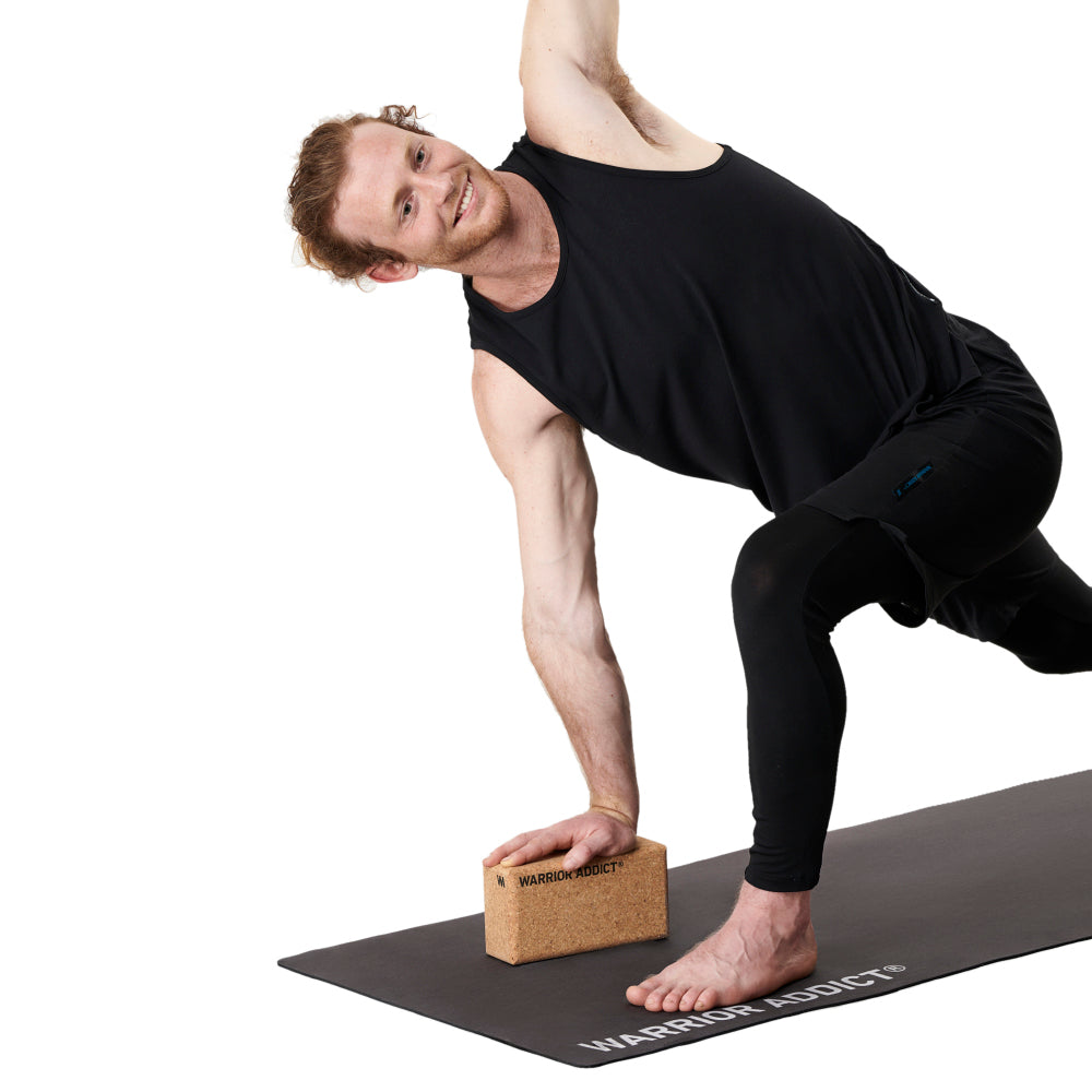 man using warrior addict cork yoga block on a warrior addict yoga mat 