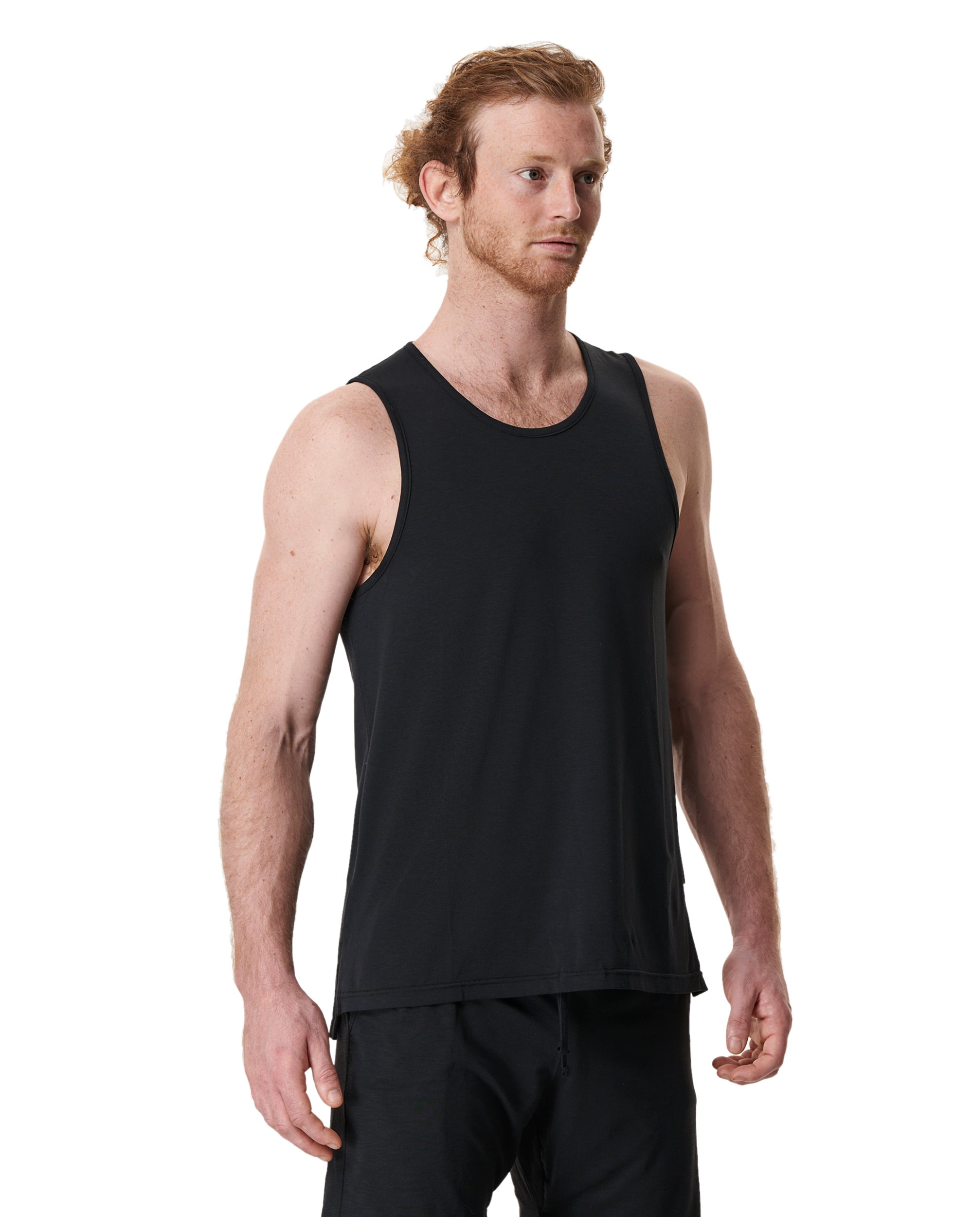 man wearing a mens yoga top in black by warrior addict 