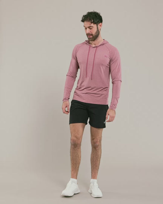 male model wearing warrior addict pink activwear hoodie and black shorts 