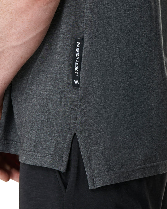 grey yoga top showing warrior addict brand label 