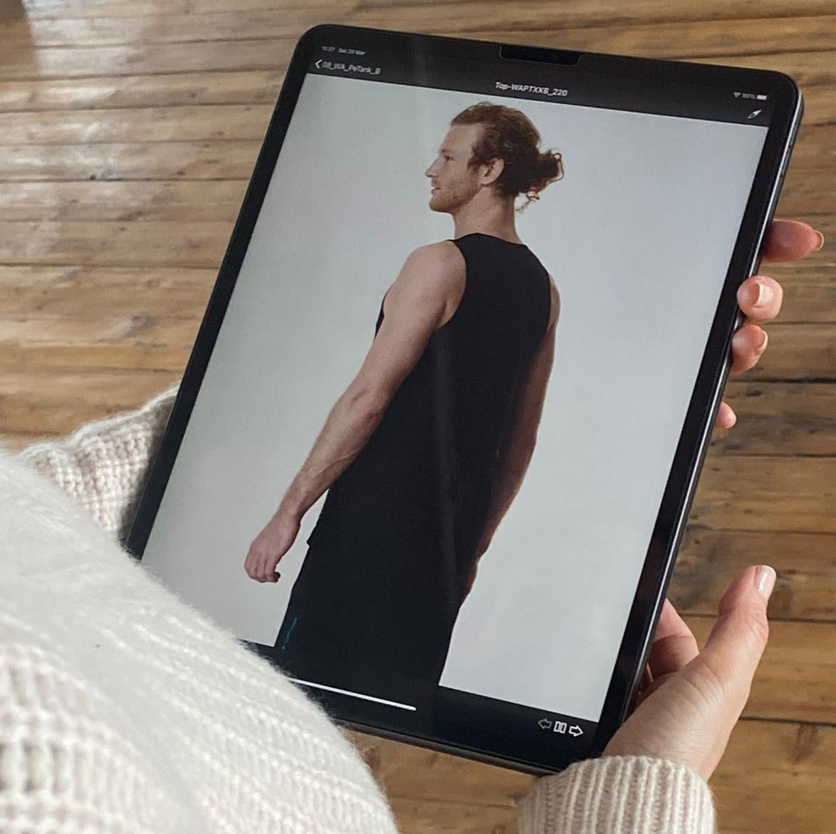 woman showing image of a man on an i-pad