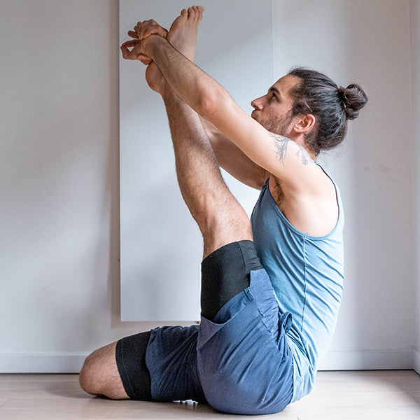 joa gomez yoga teacher doing yoga in blue warrior addict mens yoga clothes