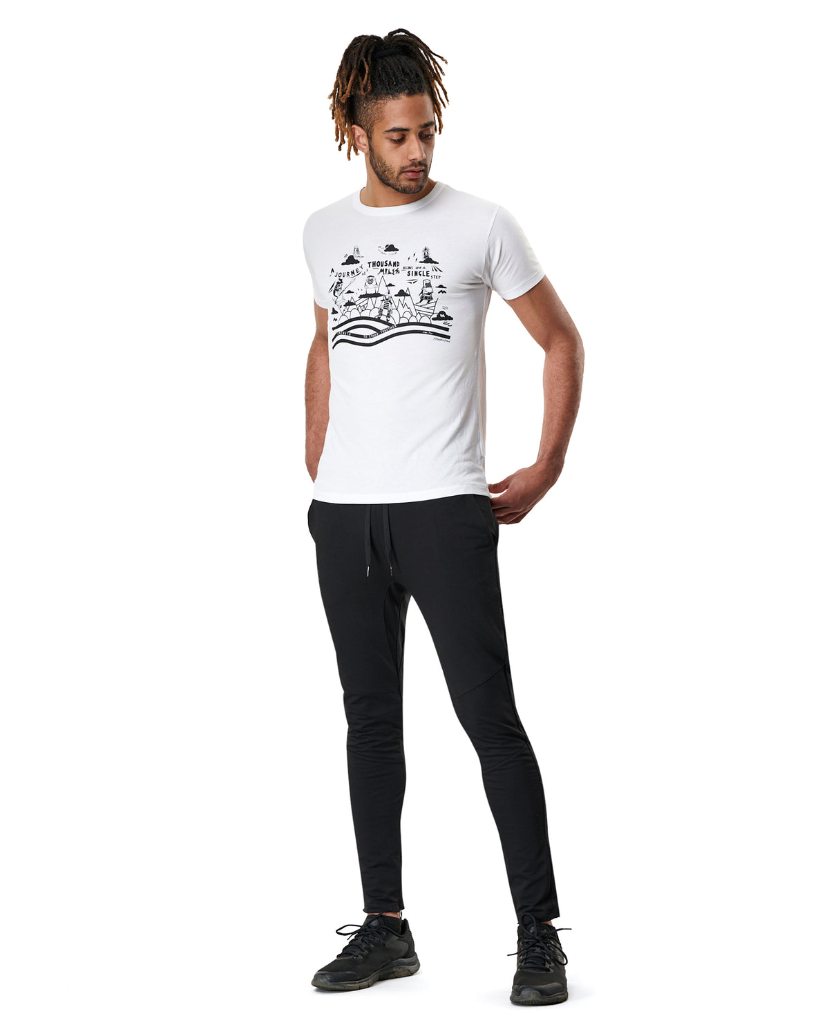 man in white mens yoga t-shirt with print and black yoga pants by warrior addict 