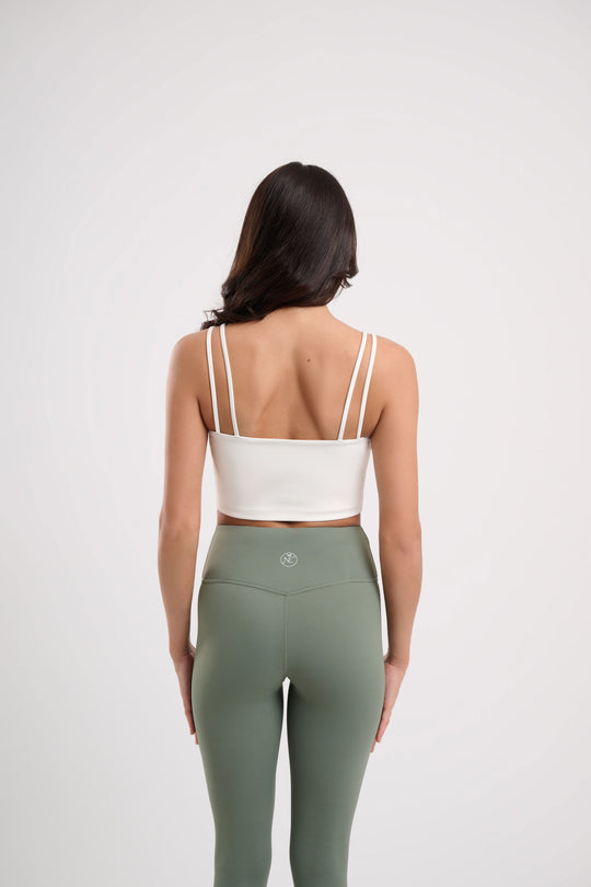 womes yoga crop top in white by naturally evie  back model shot