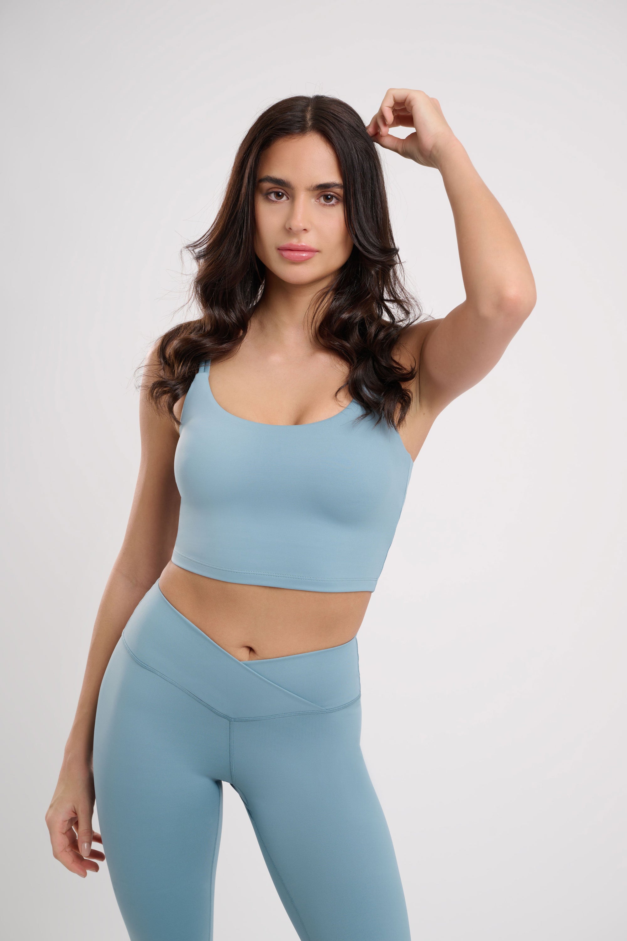 blue womens yoga crop top by naturally evie being modelled