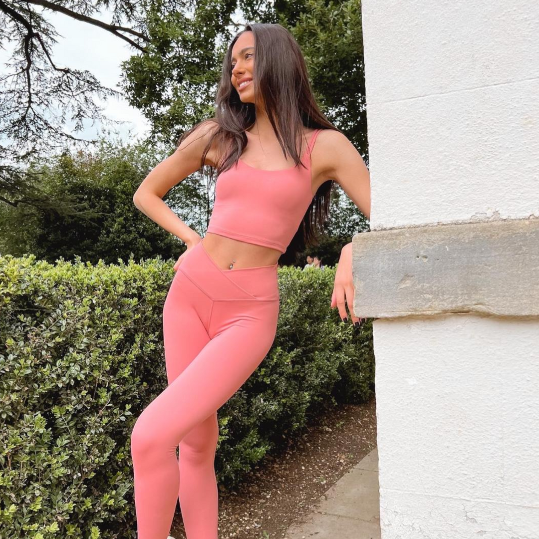 brand shot of a model wearing NE Activwear in pink womens yoga top and womens yoga pants
