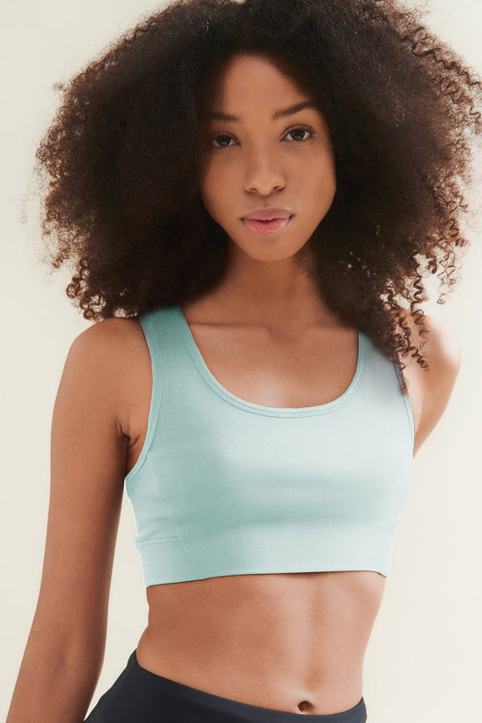 turqoise womens yoga crop top worn by model 