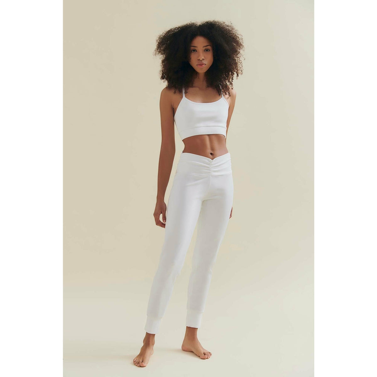 womens yoga pants in white by wellicious worn by a model 