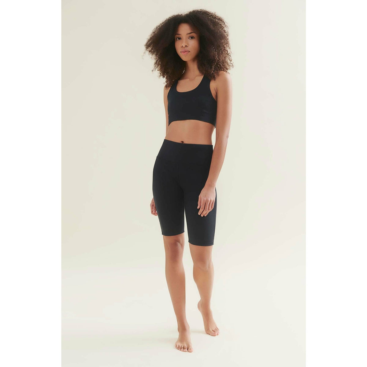 womens yoga shorts in black by wellicious full model shot