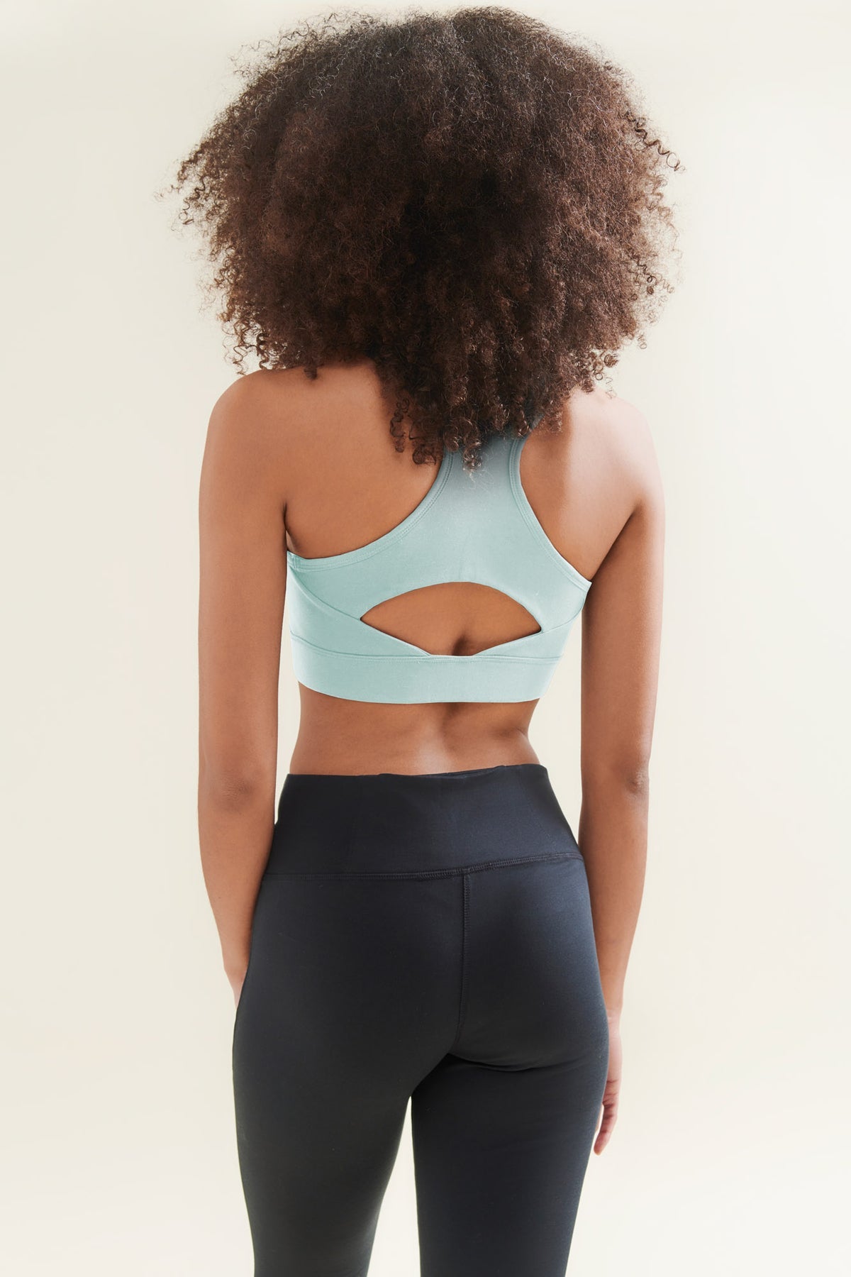 Back of yoga crop top and black yoga pants 